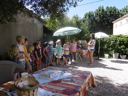 On Friday, during the coffee-break, children performing French songs with Laura, their teacher to an attentive and delighted adult audience