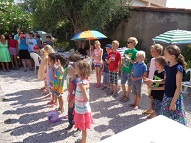 The Children performing French songs and the parents and students enjoying