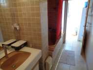 Bathroom with washbasin and shower