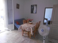 Same kitchen with dining corner and fans