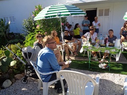 An intermediate group  in the garden with Christine in charge